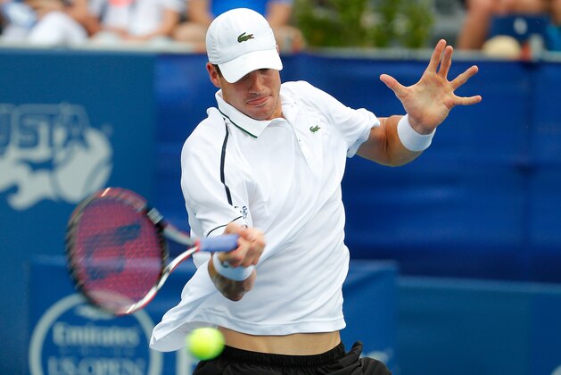 ATLANTA, GA - JULY 30:  John Isner returns a forehand to Radek Stepanek of the Czech Republic during the BB&T Atlanta Open at Atlantic Station on July 30, 2015 in Atlanta, Georgia.  (Photo by Kevin C. Cox/Getty Images)
