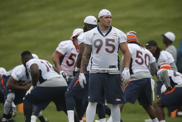 Denver Broncos defensive end Derek Wolfe takes part in drills during an NFL minicamp at the team's headquarters Wednesday, June 10, 2015, in Englewood, Colo. (AP Photo/David Zalubowski)