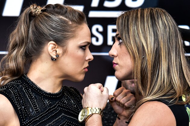 RIO DE JANEIRO, BRAZIL - JULY 30:  Bantamweight fighters Ronda Rousey (L) of the United States and Bethe Correia of Brazil face off during Ultimate Media Day at Sheraton Hotel on July 30, 2015 in Rio de Janeiro, Brazil.  (Photo by Buda Mendes/Zuffa LLC/Zuffa LLC via Getty Images)