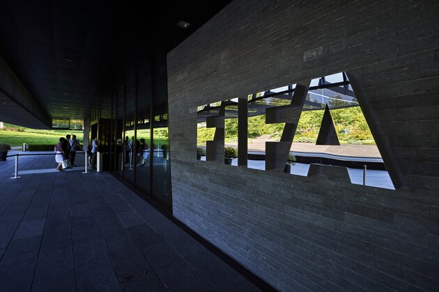 FIFA employees enter at the FIFA headquarters on June 3, 2015 in Zurich. Blatter resigned on June 2, 2015 as president of FIFA as a mounting corruption scandal engulfed world football's governing body. The 79-year-old Swiss official, FIFA president for 17 years and only reelected on May 29, said a special congress would be called as soon as possible to elect a successor. AFP PHOTO / MICHAEL BUHOLZER        (Photo credit should read MICHAEL BUHOLZER/AFP/Getty Images)