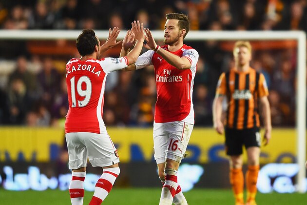 HULL, ENGLAND - MAY 04:  Aaron Ramsey of Arsenal (16) celebrates with Santi Cazorla as he scores their second goal during the Barclays Premier League match between Hull City and Arsenal at KC Stadium on May 4, 2015 in Hull, England.  (Photo by Laurence Griffiths/Getty Images)