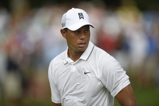 Tiger Woods looks on at the second hole during the first round of the Quicken Loans National Golf tournament at the Robert Trent Jones Golf Club in Gainesville, Va., Thursday, July 30, 2015. (AP Photo/Nick Wass)