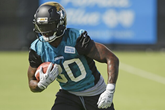 Jacksonville Jaguars running back Bernard Pierce runs through a drill during NFL football organized training activities, Wednesday, May 27, 2015, in Jacksonville, Fla. (AP Photo/John Raoux)