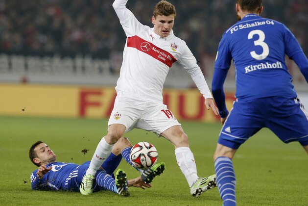 Stuttgart's Timo Werner, right, and Schalke's Tranquillo Barnetta from Switzerland challenge for the ball during a German first division Bundesliga soccer match between VfB Stuttgart and FC Schalke 04 in Stuttgart, Germany, Saturday, Dec. 6, 2014. (AP Photo/Michael Probst