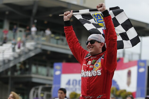 Kyle Busch celebrates after winning the NASCAR Brickyard 400 auto race at Indianapolis Motor Speedway in Indianapolis, Sunday, July 26, 2015. (AP Photo/AJ Mast)
