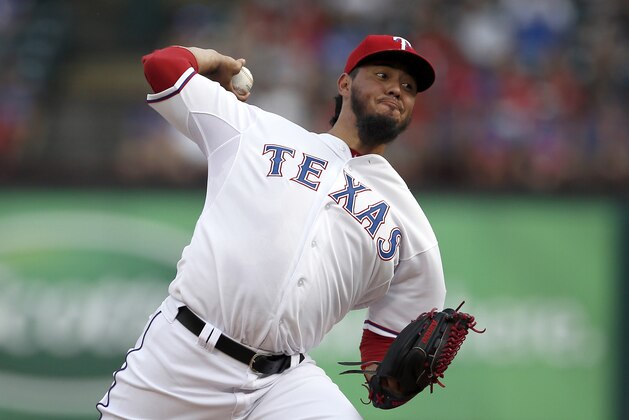 Texas Rangers starting pitcher Yovani Gallardo works against the New York Yankees in the first inning of a baseball game Thursday, July 30, 2015, in Arlington, Texas. (AP Photo/Tony Gutierrez)