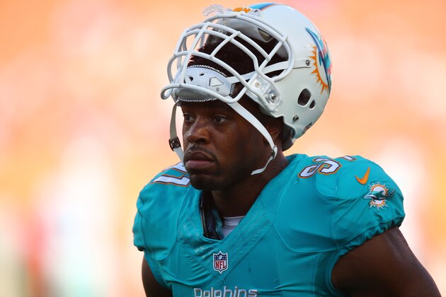 Miami Dolphins defensive end Cameron Wake (91) on the field before an NFL preseason football game against the Dallas Cowboys, Saturday, Aug. 23, 2014 in Miami Gardens, Fla. (AP Photo/Lynne Sladky)