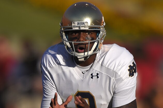 Notre Dame quarterback Malik Zaire yells to his team during the second half an NCAA college football game against Southern California, Saturday, Nov. 29, 2014, in Los Angeles. Southern California won 49-14. (AP Photo/Mark J. Terrill)
