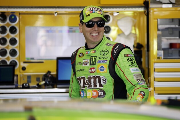 Kyle Busch smiles before a practice session for Sunday's NASCAR Pocono 400 auto race, Friday, July 31, 2015, in Long Pond, Pa. (AP Photo/Matt Slocum)