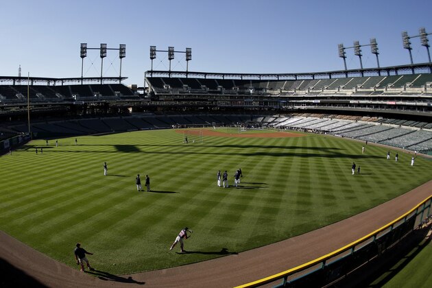Players for the Boston Red Sox and the Detroit Tigers practice at Comerica Park for Game 3 of the American League baseball championship series Monday, Oct. 14, 2013, in Detroit. (AP Photo/Charlie Riedel)