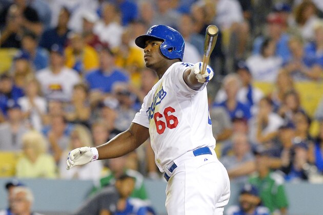 Los Angeles Dodgers' Yasiel Puig hits a two-run home run during the fourth inning of a baseball game against the Oakland Athletics, Wednesday, July 29, 2015, in Los Angeles. (AP Photo/Mark J. Terrill)