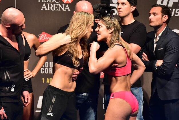 Jul 31, 2015; Rio de Janeiro, RJ, Brazil; Ronda Rousey  (left) and Bethe Correia (right) face off during weigh-ins for UFC 190 at HSBC Arena. Mandatory Credit: Jason Silva-USA TODAY Sports