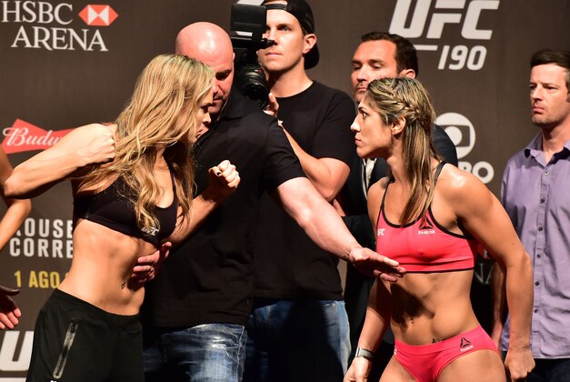 Jul 31, 2015; Rio de Janeiro, RJ, Brazil; Ronda Rousey  (left) and Bethe Correia (right) face off during weigh-ins for UFC 190 at HSBC Arena. Mandatory Credit: Jason Silva-USA TODAY Sports