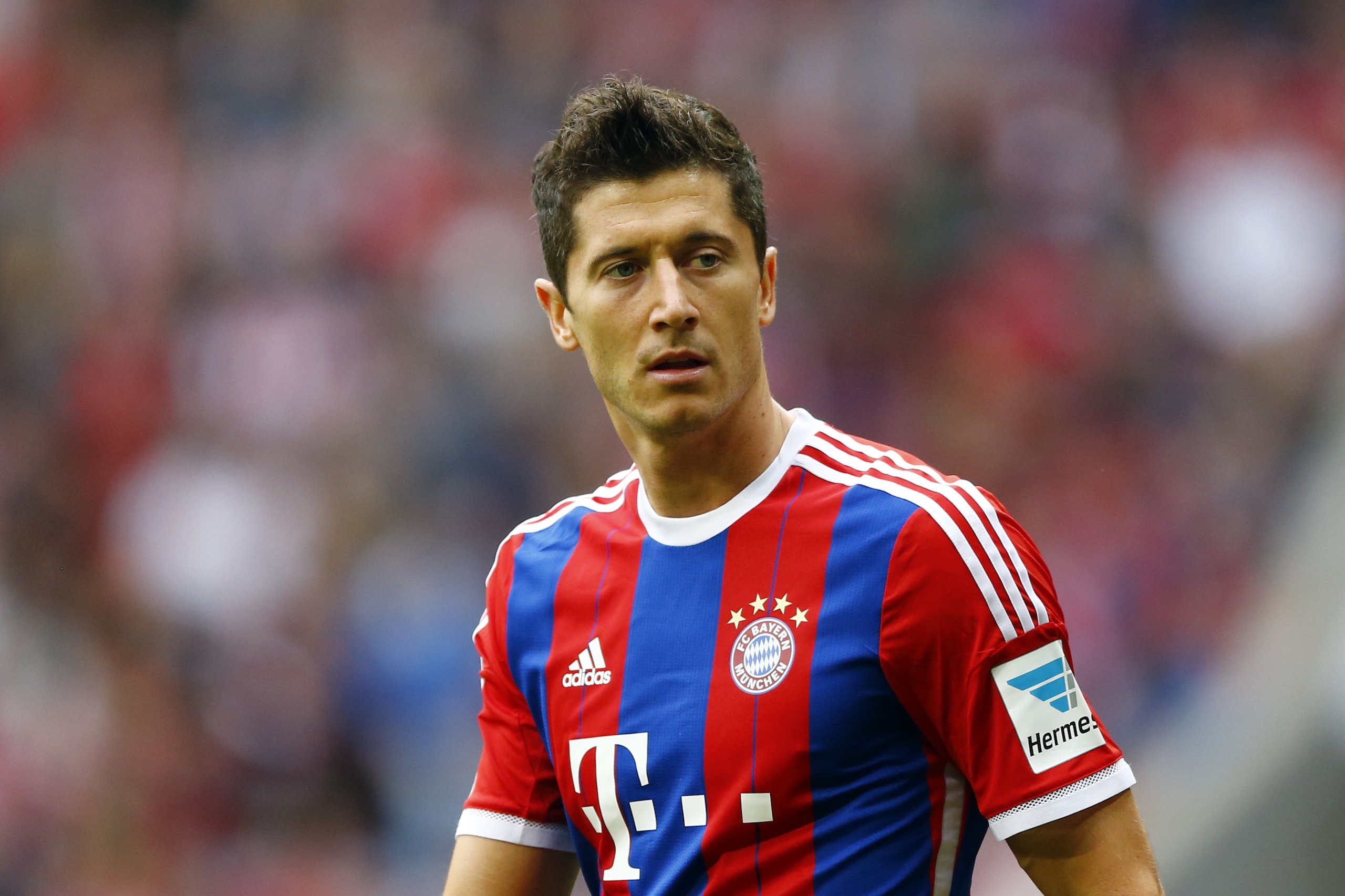 Bayern's Robert Lewandowski from Poland watches his teammates during the German first division Bundesliga soccer match between FC Bayern Munich and Hertha BSC at the Allianz Arena in Munich, Germany, on Saturday, April 25, 2015. (AP Photo/Matthias Schrader)