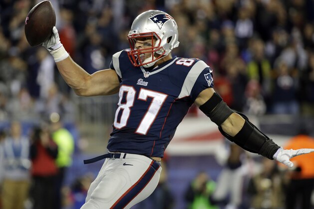 New England Patriots tight end Rob Gronkowski celebrates his touchdown catch against the Cincinnati Bengals in the second half of an NFL football game Sunday, Oct. 5, 2014, in Foxborough, Mass. (AP Photo/Stephan Savoia)