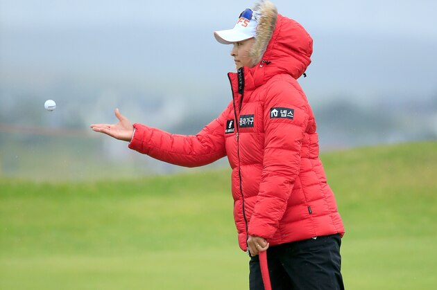 TURNBERRY, SCOTLAND - AUGUST 01:  Jin-Young Ko of South Korea throws her ball to her caddie at the par 3, 15th hole during the third round of the 2015 Ricoh Women's British Open on the Ailsa Course at the Trump Turnberry Resort on August 01, 2015 in Turnberry, Scotland.  (Photo by David Cannon/Getty Images)