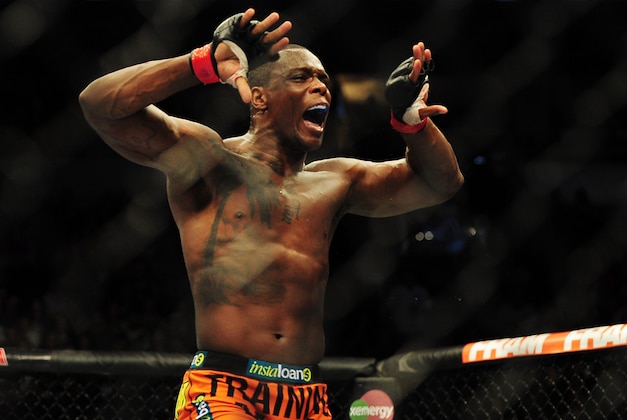 Jun 14, 2014; Vancouver, British Columbia, Canada; Ovince Saint Preux (red) reacts after defeating Ryan Jimmo (blue) in their light heavyweight bout for UFC 174 at Rogers Arena. Mandatory Credit: Anne-Marie Sorvin-USA TODAY Sports