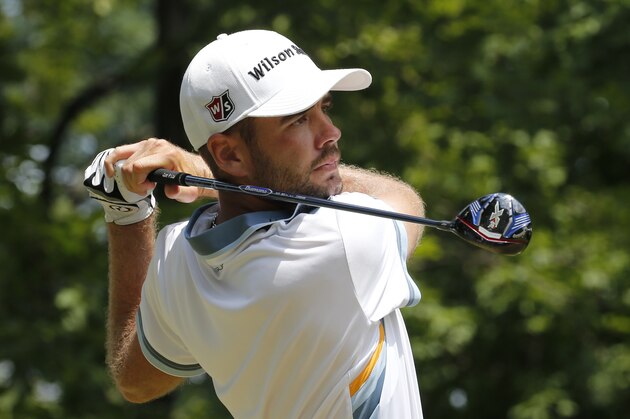 Troy Merritt watches his tee shot on the 15th hole during the third round of the Quicken Loans National golf tournament at the Robert Trent Jones Golf Club in Gainesville, Va., Saturday, Aug. 1, 2015.  (AP Photo/Steve Helber)