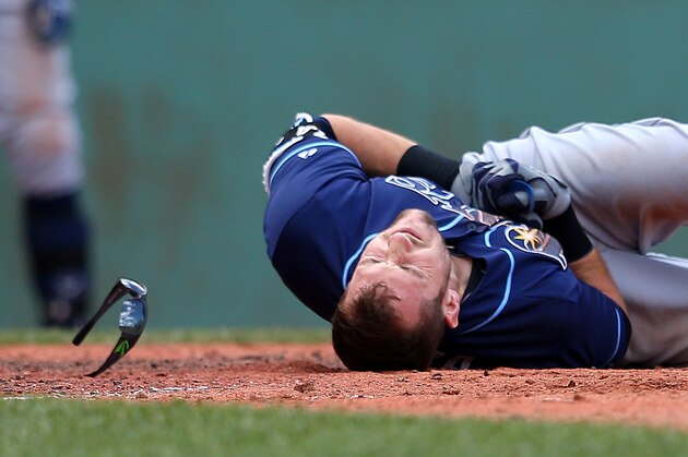 BOSTON, MA - AUGUST 1:  Steven Souza Jr. #20 of the Tampa Bay Rays falls to the ground after he was hit by a pitch in the fifth inning against the Boston Red Sox at Fenway Park on August 1, 2015 in Boston, Massachusetts.  (Photo by Jim Rogash/Getty Images)
