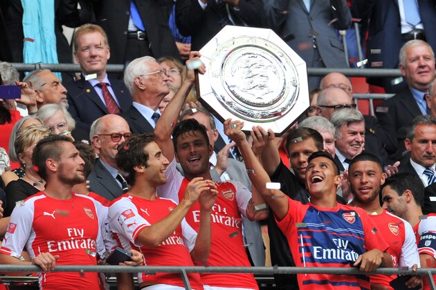 QUALITY REPEAT
Arsenal's French striker Olivier Giroud (CL) and Arsenal's Chilean midfielder Alexis Sanchez (CR) raise the Community Shield trophy after Arsenal won the FA Community Shield football match between Arsenal and Manchester City at Wembley Stadium in north London on August 10, 2014. AFP PHOTO / GLYN KIRK -- NOT FOR MARKETING OR ADVERTISING USE / RESTRICTED TO EDITORIAL USE (Photo credit should read GLYN KIRK/AFP/Getty Images) QUALITY REPEAT
Arsenal's French striker Olivier Giroud (CL) and Arsenal's Chilean midfielder Alexis Sanchez (CR) raise the Community Shield trophy after Arsenal won the FA Community Shield football match between Arsenal and Manchester City at Wembley Stadium in north London on August 10, 2014. AFP PHOTO / GLYN KIRK -- NOT FOR MARKETING OR ADVERTISING USE / RESTRICTED TO EDITORIAL USE (Photo credit should read GLYN KIRK/AFP/Getty Images)