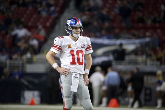 New York Giants quarterback Eli Manning pauses during the second half of NFL football game against the St. Louis Rams Sunday, Dec. 21, 2014, in St. Louis. The Giants won 37-27. (AP Photo/Charlie Riedel)