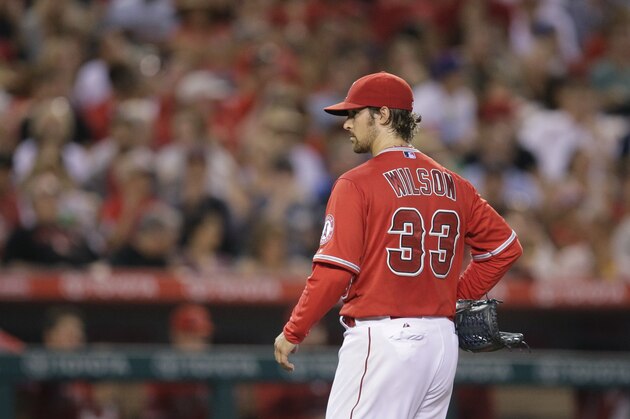 Los Angeles Angels starting pitcher C.J. Wilson walks off the mound after he was relieved during the fourth inning of a baseball game against the Houston Astros, Tuesday, June 23, 2015, in Anaheim, Calif. (AP Photo/Jae C. Hong)