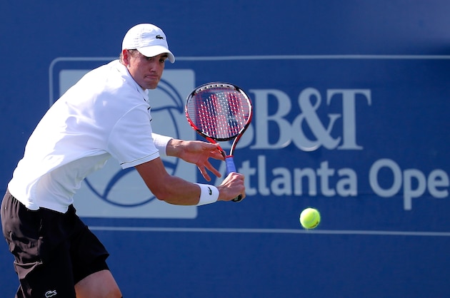 ATLANTA, GA - AUGUST 01:  John Isner returns a backhand to Denis Kudla during the BB&T Atlanta Open at Atlantic Station on August 1, 2015 in Atlanta, Georgia.  (Photo by Kevin C. Cox/Getty Images)
