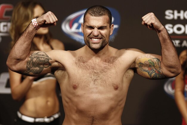Aug 16, 2013; Boston, MA, USA; Shogun Rua flexes during the weigh-in for his UFC fight at TD Garden. Mandatory Credit: Winslow Townson-USA TODAY Sports