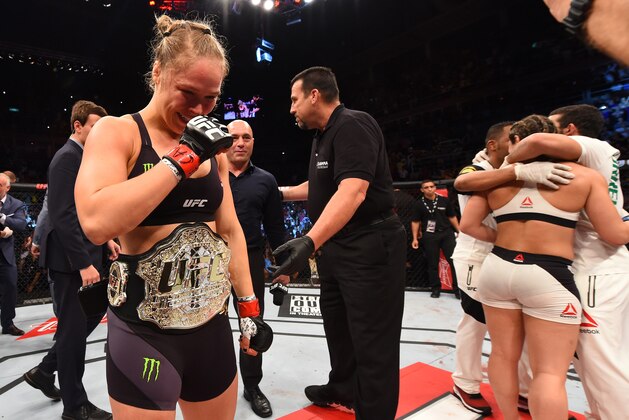 RIO DE JANEIRO, BRAZIL - AUGUST 01:  (L-R) Ronda Rousey of the United States celebrates her knock out victory over Bethe Correia of Brazil in the first round in their UFC women's bantamweight championship bout during the UFC 190 event inside HSBC Arena on August 1, 2015 in Rio de Janeiro, Brazil.  (Photo by Josh Hedges/Zuffa LLC/Zuffa LLC via Getty Images)