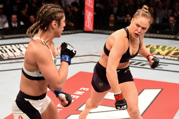 RIO DE JANEIRO, BRAZIL - AUGUST 01:  (R-L) Ronda Rousey of the United States throws a punch at Bethe Correia of Brazil in their UFC women's bantamweight championship bout during the UFC 190 event inside HSBC Arena on August 1, 2015 in Rio de Janeiro, Brazil.  (Photo by Josh Hedges/Zuffa LLC/Zuffa LLC via Getty Images)