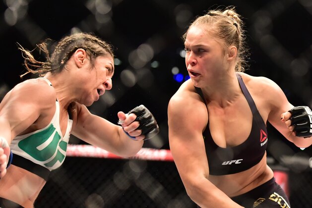 Aug 1, 2015; Rio de Janeiro, RJ, Brazil; Ronda Rousey (red gloves) fights Bethe Correia (blue gloves) during UFC 190 at HSBC Arena. Mandatory Credit: Jason Silva-USA TODAY Sports