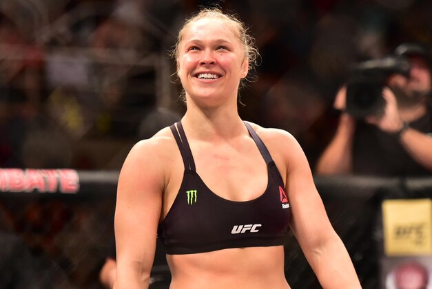 Aug 1, 2015; Rio de Janeiro, RJ, Brazil; Ronda Rousey (red gloves) reacts after knocking out Bethe Correia (not pictured) during UFC 190 at HSBC Arena. Mandatory Credit: Jason Silva-USA TODAY Sports
