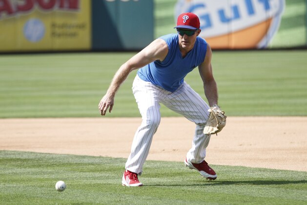 Philadelphia Phillies second baseman Chase Utley fields the ball prior to the first inning of a baseball game against the Tampa Bay Rays, Monday, July 20, 2015, in Philadelphia. (AP Photo/Chris Szagola)