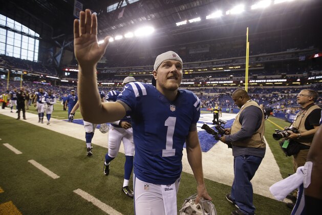 Indianapolis Colts punter Pat McAfee waves to fans as he leaves the field following a 17-10 win over the Houston Texans an NFL football game in Indianapolis, Sunday, Dec. 14, 2014. (AP Photo/Darron Cummings)