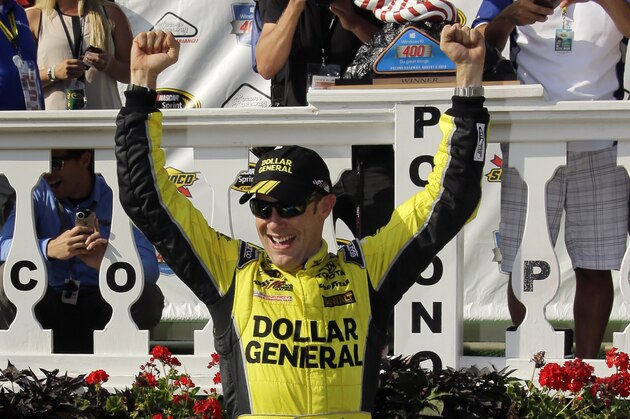 Matt Kenseth celebrates in victory lane after winning the NASCAR Pocono 400 auto race, Sunday, Aug. 2, 2015, in Long Pond, Pa. (AP Photo/Matt Slocum)