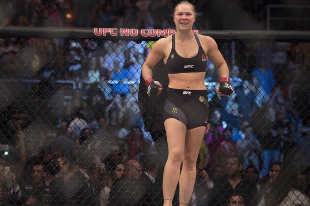 RIO DE JANEIRO, BRAZIL - AUGUST 01:  UFC women's bantamweight champion Ronda Rousey of the United States celebrates after defeating Bethe Correia of Brazil by KO during the UFC 190 event inside HSBC Arena on August 1, 2015 in Rio de Janeiro, Brazil.  (Photo by Jeff Bottari/Zuffa LLC/Zuffa LLC via Getty Images)