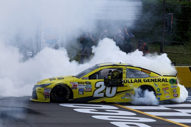 LONG POND, PA - AUGUST 02:  Matt Kenseth, driver of the #20 Dollar General Toyota, celebrates with a burnout after winning the NASCAR Sprint Cup Series Windows 10 400 at Pocono Raceway on August 2, 2015 in Long Pond, Pennsylvania.  (Photo by Jerry Markland/Getty Images)