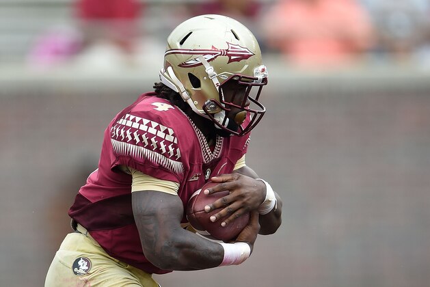 TALLAHASSEE, FL - APRIL 11:  Dalvin Cook #4 of the Garnet team runs for yards against the Gold team during Florida State's Garnet and Gold spring game at Doak Campbell Stadium on April 11, 2015 in Tallahassee, Florida.  (Photo by Stacy Revere/Getty Images)