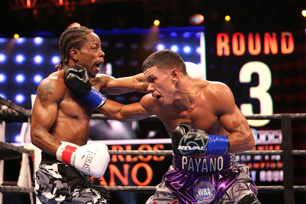 WINTER PARK, FL - AUGUST 02: Juan Carlos Payano (R) fights against Rau'shee Warren during the Premier Boxing Champions on Bounce TV boxing match at Full Sail University - Ebbs Auditorium on August 2, 2015 in Winter Park, Florida. Payano won the bout and retained his WBA and IBO  bantamweight title. (Photo by Alex Menendez/Getty Images)