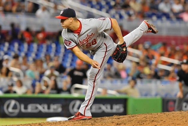 Jul 30, 2015; Miami, FL, USA; Washington Nationals relief pitcher Jonathan Papelbon (58) throws against the Miami Marlins during the ninth inning at Marlins Park. Mandatory Credit: Steve Mitchell-USA TODAY Sports
