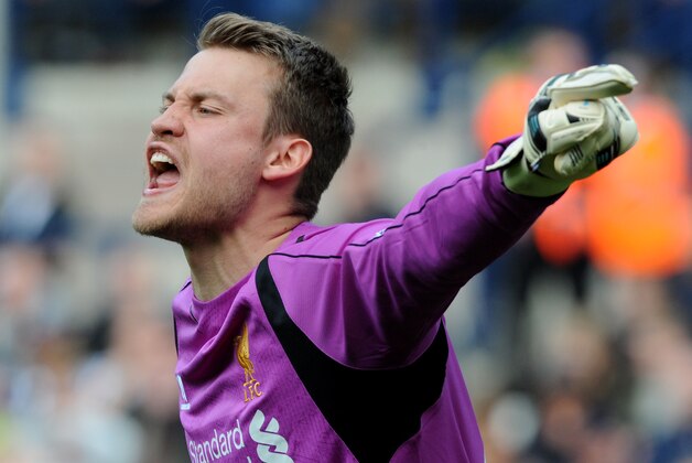 Liverpool goalkeeper Simon Mignolet points during the English Premier League soccer match between West Bromwich Albion and Liverpool at the Hawthorns, West Bromwich, England, Saturday, April 25, 2015. (AP Photo/Rui Vieira)