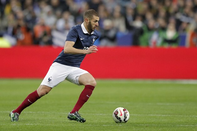 France’s Captain Karim Benzema runs with the ball during the international friendly soccer match between France and Brazil at the Stade de France, north of Paris, France, Thursday, March 26, 2015. (AP Photo/Francois Mori)