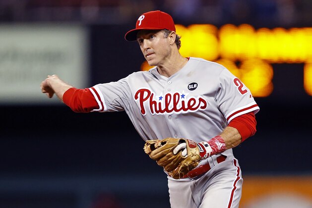 Philadelphia Phillies second baseman Chase Utley throws to first base for an out during the seventh inning of a baseball game against the St. Louis Cardinals, Monday, April 27, 2015, in St. Louis. The Phillies won the game 4-1. (AP Photo/Billy Hurst)