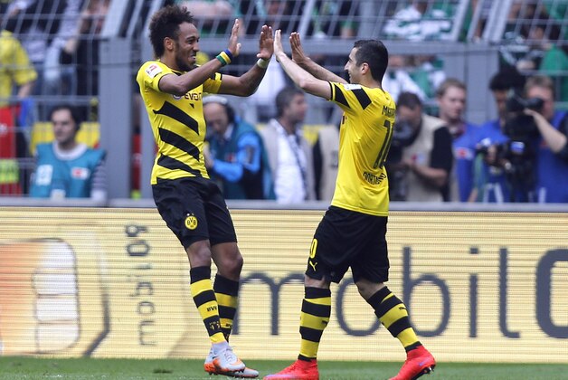 Dortmund's Pierre-Emerick Aubameyang from Gabon, left, and Dortmund's Henrikh Mkhitaryan from Armenia celebrate after scoring during the German first division Bundesliga soccer match between BvB Borussia Dortmund  and Werder Bremen in Dortmund, Germany, Saturday, May 23, 2015. (AP Photo/Frank Augstein)