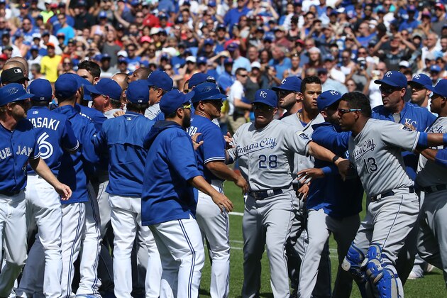 TORONTO, CANADA - AUGUST 2: Salvador Perez #13 of the Kansas City Royals is held back by teammates as both benches clear in the eighth inning during MLB game action against the Toronto Blue Jays on August 2, 2015 at Rogers Centre in Toronto, Ontario, Canada. (Photo by Tom Szczerbowski/Getty Images)