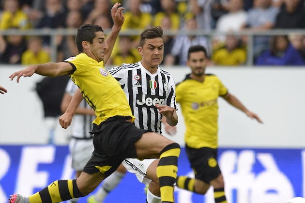 ST GALLEN, SWITZERLAND - JULY 25: Henrikh Mkhitaryan of Dortmund (L) is challenged by Paulo Dybala of Juventus during the friendly match between Juventus and Borussia Dortmund on July 25, 2015 in St Gallen, Switzerland.  (Photo by Daniel Kopatsch/Getty Images)