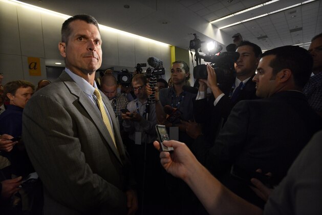 Michigan head coach Jim Harbaugh speaks to the media during the NCAA college Big Ten Football Media Day Friday, July 31, 2015 in Chicago. (AP Photo/Paul Beaty)
