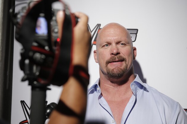 WWE Hall of Famer Stone Cold Steve Austin chats with media about WWE 2K15 at the SummerSlam Confidential Panel at Club Nokia, on Saturday, August 16, 2014 in Los Angeles. (Photo by Todd Williamson/Invision for 2K/AP Images)