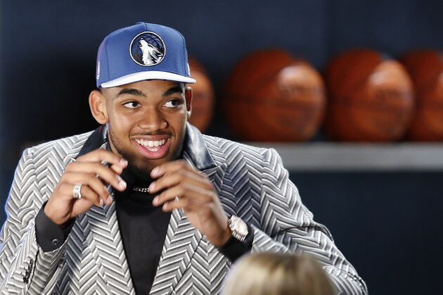 Karl-Anthony Towns reacts after being selected first overall by the Minnesota Timberwolves during the NBA basketball draft, Thursday, June 25, 2015, in New York. (AP Photo/Kathy Willens)