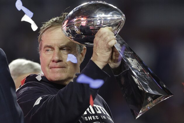 New England Patriots head coach Bill Belichick holds up the Vince Lombardi Trophy as he celebrates after the Patriots defeated the Seattle Seahawks 28-24 in NFL Super Bowl XLIX football game Sunday, Feb. 1, 2015, in Glendale, Ariz. (AP Photo/Patrick Semansky)